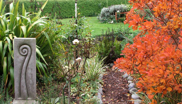  With a purple smoke bush going brilliantly orange. 