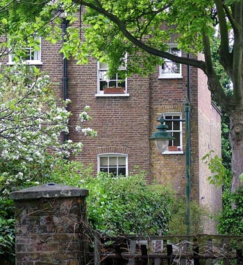  One of the tall Victorian town houses surrounding the churchyard. 