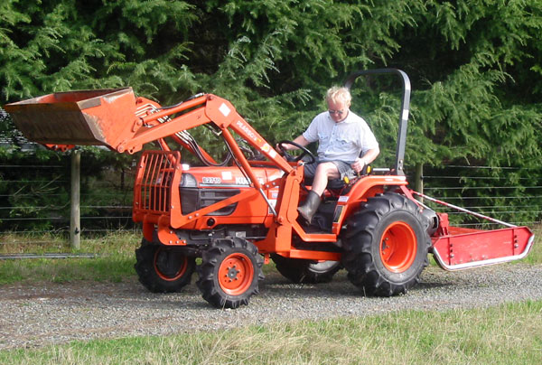  Some serious work is being done in the orchard paddock. 