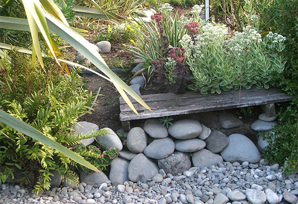  My Dog-Path garden seat, surrounded by stones. 