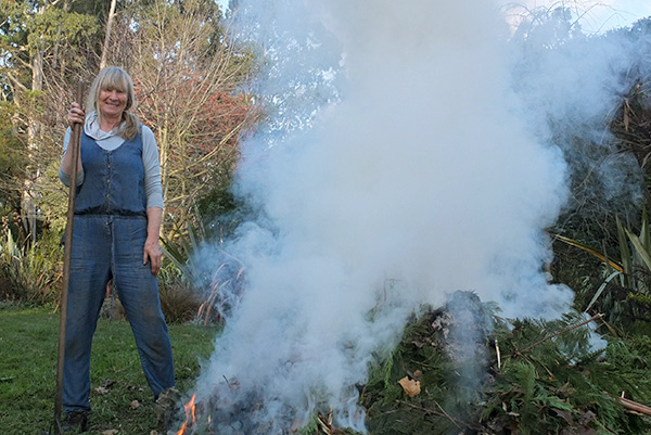  As the hedge trimmings go up in smoke. 