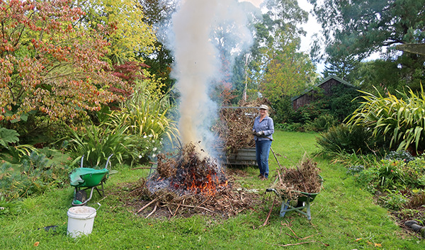  With trailer, old burnt wheelbarrow on the left and new wheelbarrow on the right. 