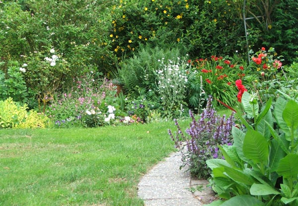  Stone pavers laid in a shallow bed of sand. 