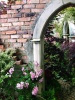 stone-garden-arch-rose