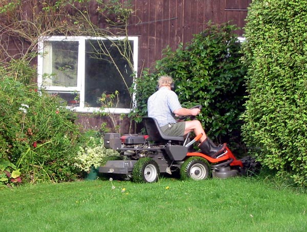  Mowing the lawn by the Sleep-out. 