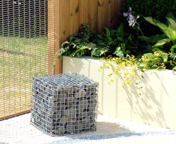 Alistair Bayford uses gabions to contain natural stone textures in his city garden Take Time To 